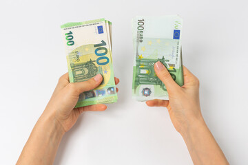 Woman counting 100 euro banknotes