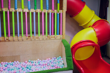 plastic slider in the children's playground. children's slide in the playroom.