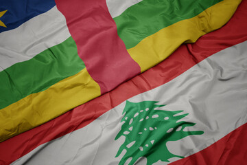 waving colorful flag of lebanon and national flag of central african republic.