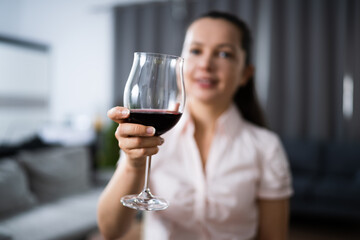 Woman Drinking Red Wine In Video Conference