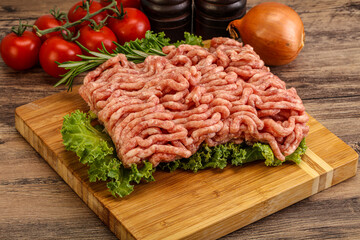 Raw pork minced meat over board