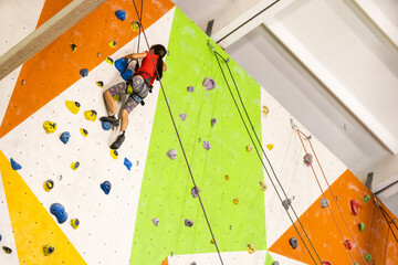 Little Girl Climbing Rock Wall