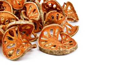 Aegle marmelos. Dry bael fruit isolated on white background.Dried herbs and dried bael fruit drink Healthy and Natural Food concept