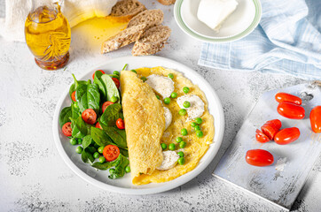 Bio eggs omelet with salad - 406118456