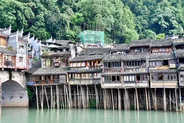 Ancient houses on the piles in the river, Fenghuang city, China