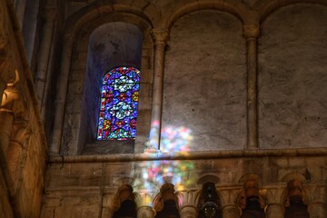 Stained glass and its shadow in cathedral in Winchester, England