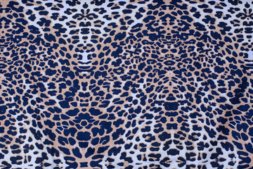Fabric with a print of leopard, cheetah skin, close-up, place for text
