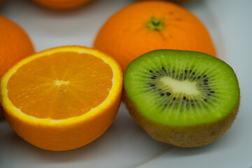 close up of sliced Kiwi fruit and citrus Orange