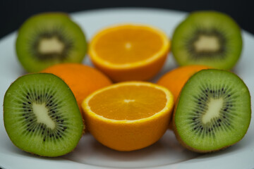 close up of sliced Kiwi fruit and citrus Orange