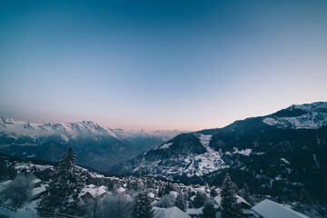 The swiss alps village of La Tzoumaz at dawn in winter, Valais, Switzerland.