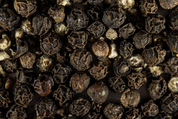 Black pepper peas close-up. Dark texture .Top view.