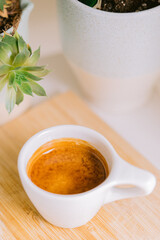 cup of tea and coffee next to plants