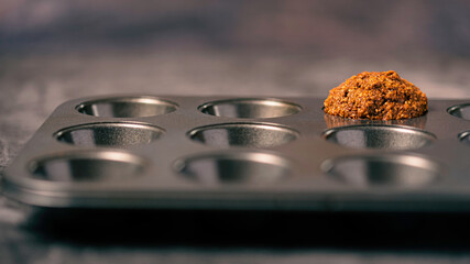 A Single Muffin in cooking tray