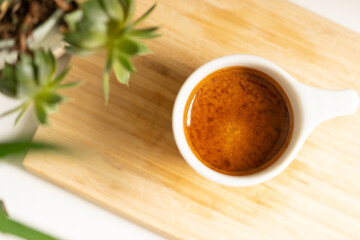 cup of coffee on wooden table