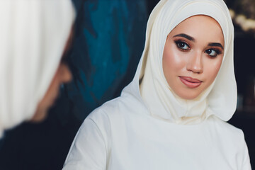 portrait of a beautiful Muslim woman in traditional Islamic clothing and cover their heads.