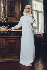 portrait of a beautiful Muslim woman in traditional Islamic clothing and cover their heads.