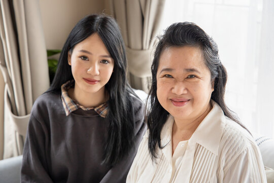 Lovely asian senior mother and young daughter with happy family life, single mom, togetherness concept