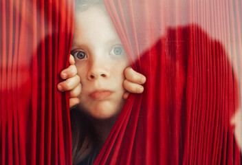 Curiours baby behind the glass