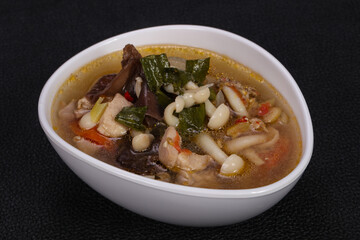 Thai style soup with meat and mushrooms