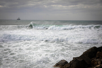 Caesarea. Storm. Sea waves crash against the ruins of the old city of Caesarea.