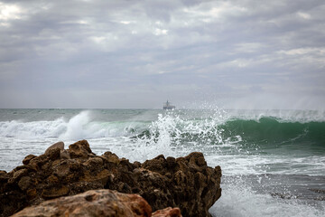 Caesarea. Storm. Sea waves crash against the ruins of the old city of Caesarea.