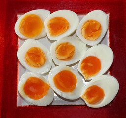 Hard Boiled Egg Halfs on a red Plate