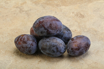Purple sweet ripe plum heap
