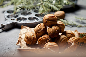 
Homemade cookies nuts with condensed milk on a wooden table. Baking tray for nuts