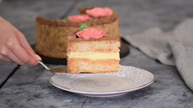 Homemade kiev cake, dacquoise cake with butter cream and hazelnuts.