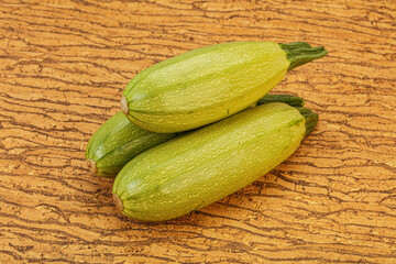 Young tasty zucchini over board