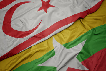 waving colorful flag of myanmar and national flag of northern cyprus.