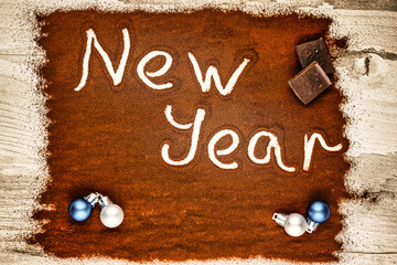 merry Christmas and happy new year on chocolate background
