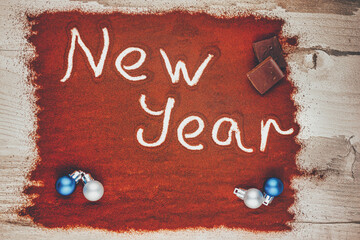 merry Christmas and happy new year on chocolate background