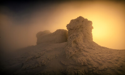 Fantastic orange sunrise over the old Polish observatory on Mount Pip Ivan. Incredible winter landscape with frozen building in top of mountain. Carpathian mountains, Ukraine, Europe