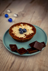turquoise plate with a cake and chocolate bars