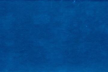 Cardboard blue abstract pattern texture close-up. Retro old paper background. Grunge concrete wall. Vintage blank wallpaper.