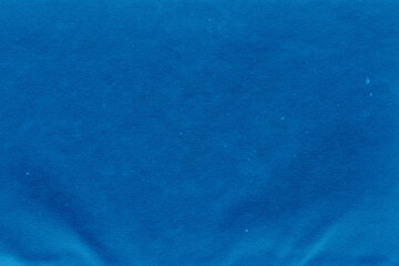 Cardboard blue abstract pattern texture close-up. Retro old paper background. Grunge concrete wall. Vintage blank wallpaper.