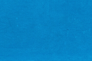 Cardboard blue abstract pattern texture close-up. Retro old paper background. Grunge concrete wall. Vintage blank wallpaper.