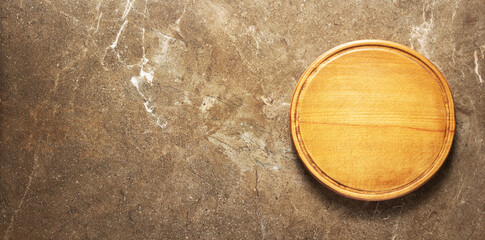 Pizza or bread cutting board for homemade baking on table. Food recipe concept at stone background texture