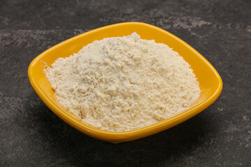 Wheat flour heap in the bowl