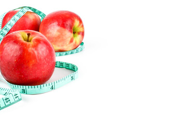 Close Up Red Apple with Measuring Meter tape for the healthy diet and slimming. isolated on white background. lose weight concept