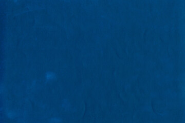 Cardboard blue abstract pattern texture close-up. Retro old paper background. Grunge concrete wall. Vintage blank wallpaper.