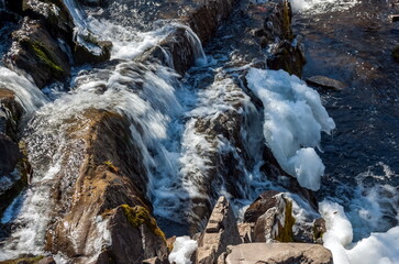 A small waterfall on the river in the spring