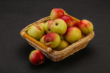 Sweet small nectarines in the basket