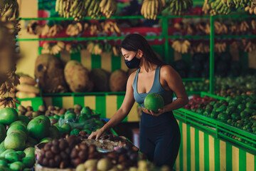 Young girl in a mask in a fruit store
