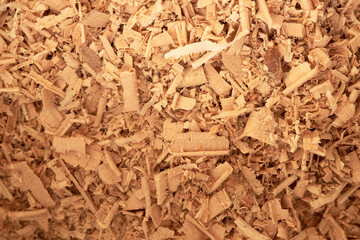 Wood sawdust background closeup. Sawdust texture, close-up background of brown sawdust.