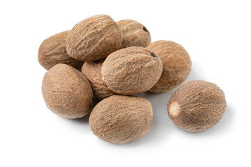  Heap of whole dried nutmeg seeds isolated on white background