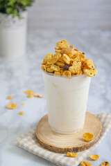 Fresh milk with iced on topped cornflake in glass plastic.