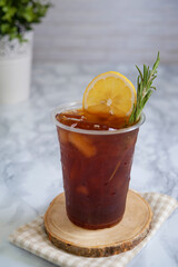 Lemon ice tea in glass plastic.