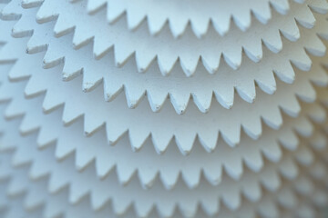 White background with a green tint. Abstraction. Concentric wooden circles similar to gears.